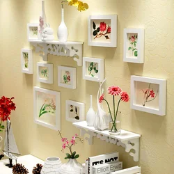 Wall with frames in the kitchen interior