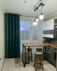 Gray kitchen interior with turquoise curtains