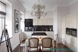 Dark table in the interior of a light kitchen