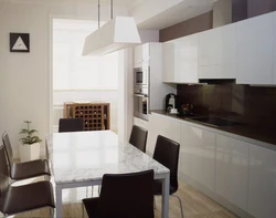 Dark table in the interior of a light kitchen