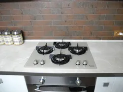 Black hob in the kitchen interior