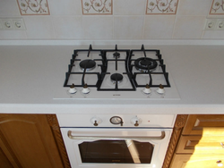 Black hob in the kitchen interior