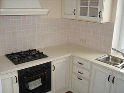 Black hob in the kitchen interior