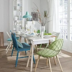 Green chairs in the interior of a gray kitchen
