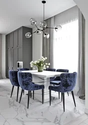 Green chairs in the interior of a gray kitchen