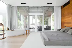 Bedroom interior with floor-to-ceiling windows