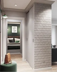 Brick wall in the interior of the hallway with your own