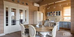 White kitchen interior in a timber house