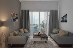 Curtains to the gray floor in the living room interior
