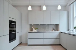 Kitchen without handles white glossy in the interior