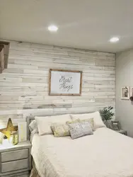 Gray laminate on the wall in the bedroom interior