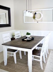 White Table With Black Legs In The Kitchen Interior