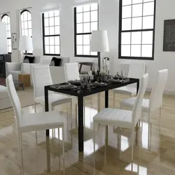 White table with black legs in the kitchen interior