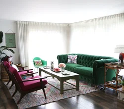 Curtains in a gray living room interior with a green sofa