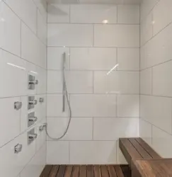 White tiles in the bathroom with black grout photo in the interior