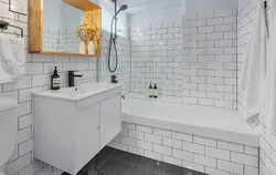 White tiles in the bathroom with black grout photo in the interior