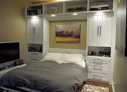 Bedroom design with built-in wardrobe and bed