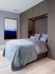Bedroom design with built-in wardrobe and bed