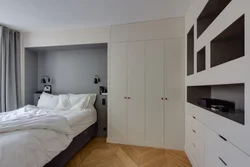 Bedroom design with built-in wardrobe and bed