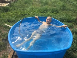 Plastic bathtub for a summer residence photo