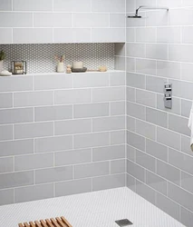 White tiles in the bathroom with white grout photo