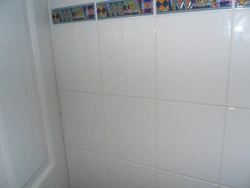 White tiles in the bathroom with white grout photo