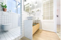 White tiles in the bathroom with white grout photo