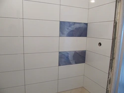 White tiles in the bathroom with white grout photo