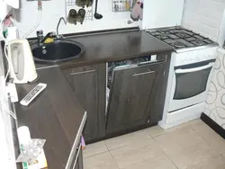Kitchen in Khrushchev with dishwasher and refrigerator photo