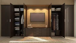 Wardrobe wall with TV in the bedroom photo