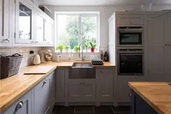 Gray white kitchens with wooden countertops photo