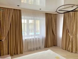 Photo of curtains for the bedroom on the ceiling cornice