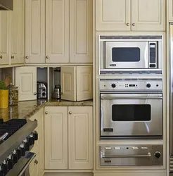 Kitchen Design With Built-In Appliances And Refrigerator Photo