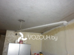 Hood under a suspended ceiling in the kitchen photo