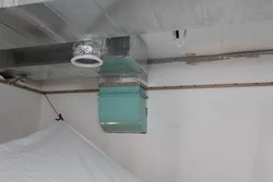 Hood under a suspended ceiling in the kitchen photo