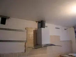 Hood under a suspended ceiling in the kitchen photo