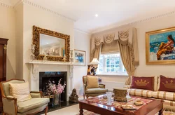 Mirror above the fireplace in the living room interior