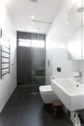 Bathroom design dark walls light floor
