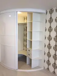 Photo Of A Corner Wardrobe In The Bedroom With A Mirror