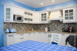 Apron for a blue kitchen made of tiles photo