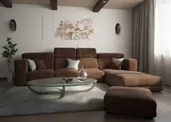 Dark sofa in the interior of a bright living room