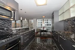 Brown tiles on the floor in the kitchen interior