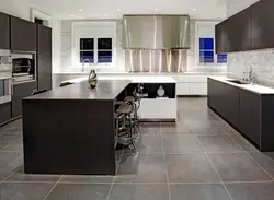 Brown tiles on the floor in the kitchen interior