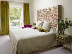 Bedroom with green bedspread photo
