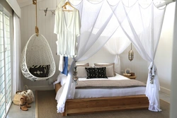 Armchair bed in the bedroom interior