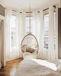 Armchair bed in the bedroom interior