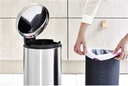 Trash can in the kitchen interior