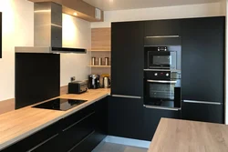 White kitchen black refrigerator photo