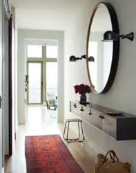 Round mirrors in the hallway interior photo