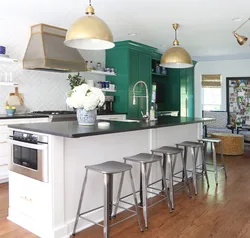 Photo of a kitchen with green chairs